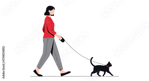 A woman in a red shirt walks her black cat on a leash.