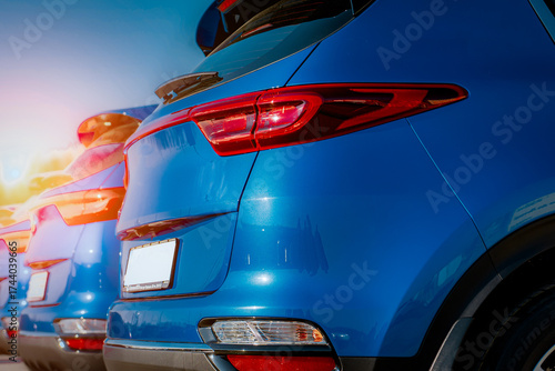 Blue business car with shiny front lights color bright