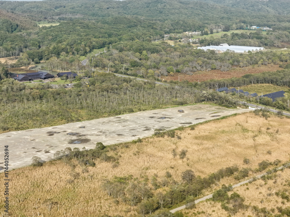 Naklejka premium Aerial view of a large solar power plant construction site near Kushiro Wetland, Hokkaido, Japan – Editorial Use Only