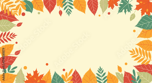 A frame made of autumnal leaves in various colors of red orange and green.