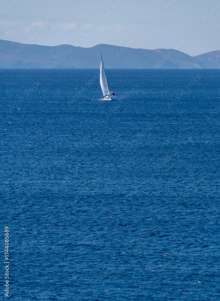 Fototapeta premium Yacht in the sunshine in the Aegean Sea in Greece