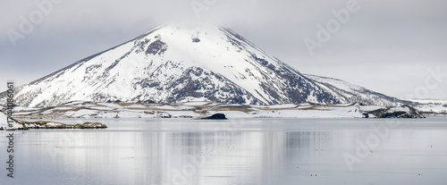 reflection in the lake of snow covered volcanic mountain, Vindbelgjarfjall , Lake, Mývatn, Iceland