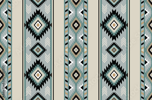 Seamless geometric ethnic pattern inspired by Native American tribal fabric. Traditional Aztec and Navajo style carpet and tile vector design on navy blue background. Perfect for textile, wrapping,