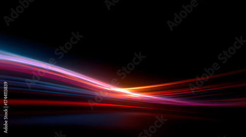 Abstract light trails against a black background