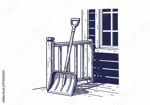 Snow shovel resting against wooden railing on porch, with window in background, showcasing winter preparation and outdoor maintenance tools for seasonal tasks