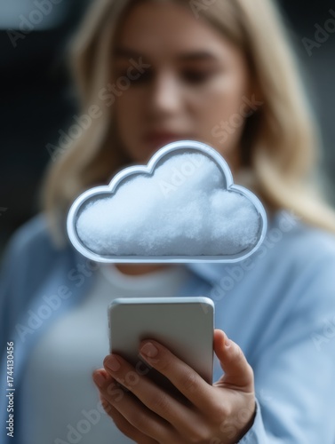 A woman holds a smartphone with a cloud graphic hovering above, symbolizing digital storage or cloud computing.