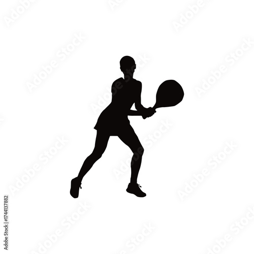 Silhouette of a female tennis player in action hitting a forehand with a racket and ball