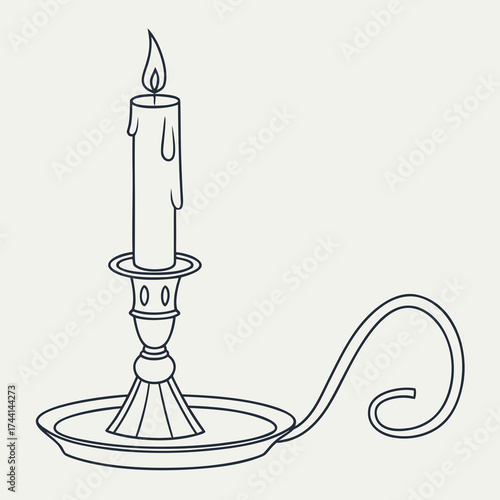 Vintage candle in a decorative candlestick with a flame