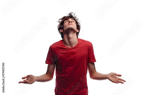 AI Image A Young Man in a Red T-Shirt Looks Upward with Open Arms Against a Dark Backdrop