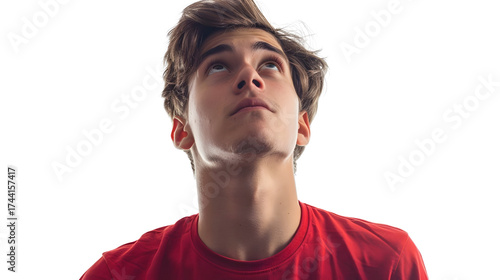AI Image: Contemplative young man looking upward with curious expression against a black background