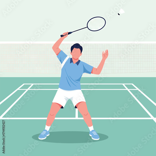 Skilled male badminton player poised for a powerful overhead shot during a competitive match on a professional court