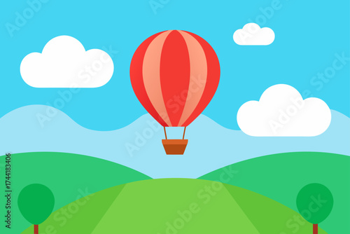 Hot air balloon flying over a green landscape view
