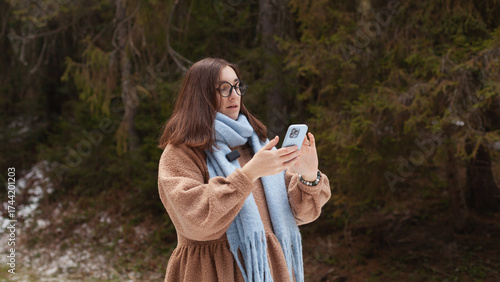 Winter blogger captures moments in the woods with smartphone during a chilly day