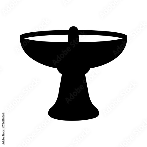 Elegant black silhouette of a vintage pedestal sink against white backdrop