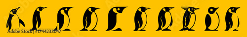 A line of emperor penguins in silhouette on a yellow background
