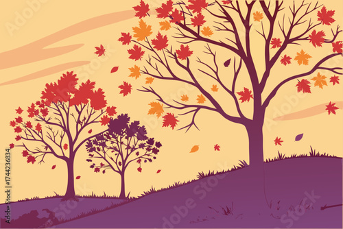 Silhouetted trees with vibrant changing autumn leaves in fall season
