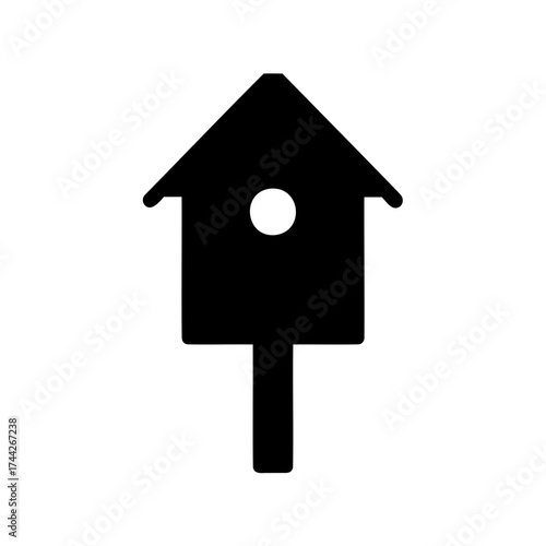 Simple black and white silhouette of a classic wooden birdhouse design