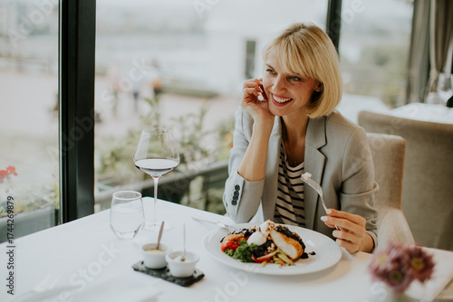 Woman enjoys fine dining ex...