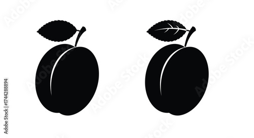 Two black silhouette plums with stems and leaves isolated on white