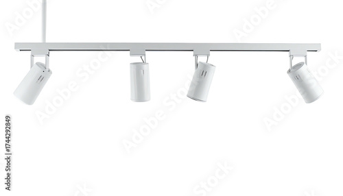 Sleek, white track lighting system with four adjustable spotlights hanging against a black void