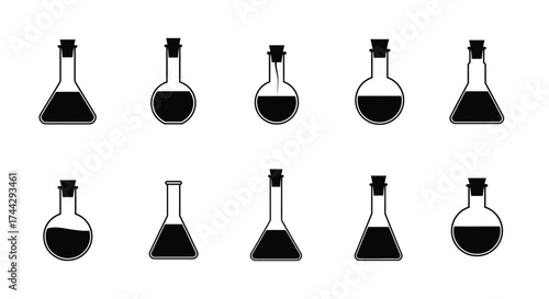 Collection of laboratory flasks with dark liquid and cork stoppers shown