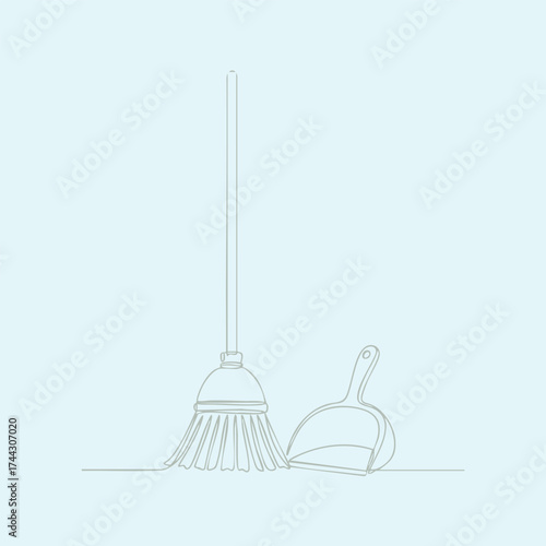 Cleaning tools including a mop and dustpan set against a plain for janitorial or household cleaning activities
