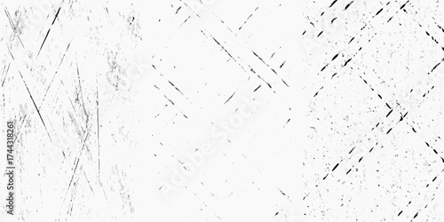 Abstract distressed grunge texture with diagonal scratches and speckles on white background