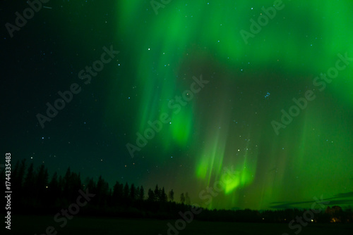 Aurora borealis Northern Lights fully covered the sky. Lapland amazing scenery