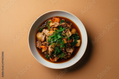 Wallpaper Mural Bowl of Hearty Stew With Meat, Potatoes, Carrots and Greens Served on a Neutral Color Background Torontodigital.ca