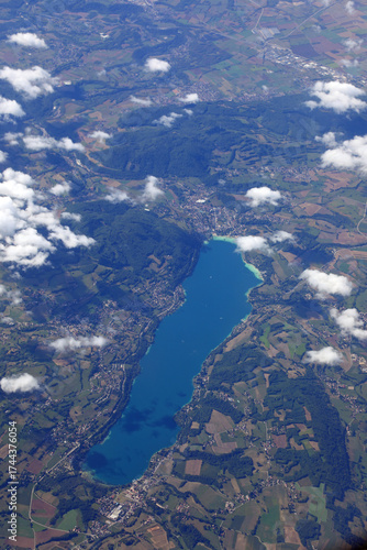Bild auf Leinwand high angle view of a lake in the middle of the flat land and the white clouds