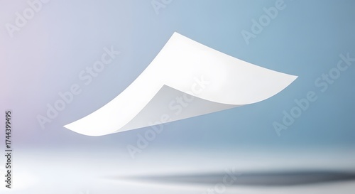 A single sheet of white paper floats gracefully against a softly lit light blue gradient backdrop, casting a subtle shadow below. The paper's form is simple yet elegant.