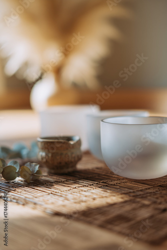 Crystal Singing Bowls with Dried Eucalyptus in Soft Sunlight