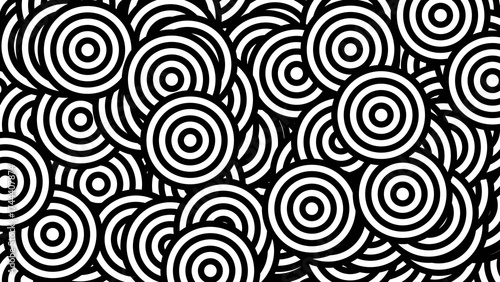Overlapping Concentric Circles in a Chaotic Black and White Abstract Pattern.