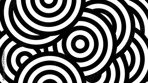 Overlapping Concentric Circles in a Chaotic Black and White Abstract Pattern.