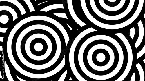 Overlapping Concentric Circles in a Chaotic Black and White Abstract Pattern.