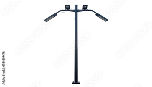 A tall, dark metal streetlamp with four lights on a black background