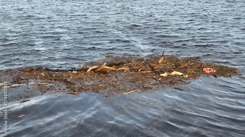 Rubbish floating on the River Clyde in Glasgow polluting the water