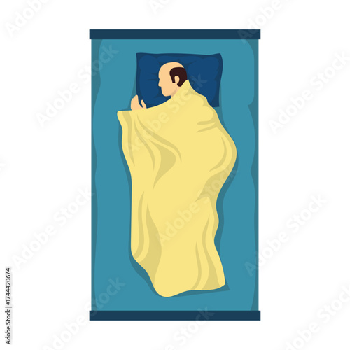 Overhead view of a person sleeping soundly under a warm yellow blanket on a blue bed