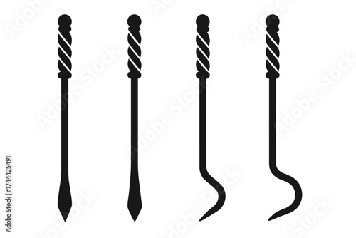 Set of four black metal skewers with twisted handles
