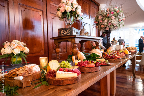 Catering charcuterie board with cheese, grapes, and salami