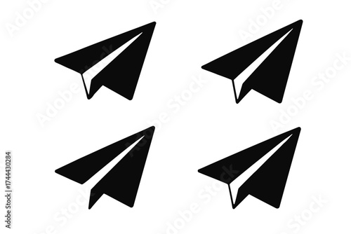 Set of four black paper airplane icons on white background