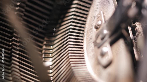 Extreme close-up of vintage typewriter hammers striking paper. Cinematic macro shot showing mechanical motion and detail inside an old typewriter.