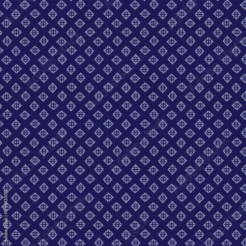 Elegant ornamental seamless pattern on dark blue background for textile design