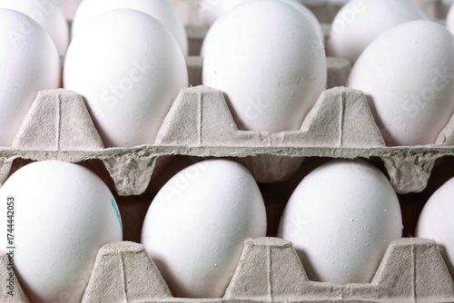 Close Up Of Fresh White Chicken Eggs In Two Stacked Cardboard Cartons. Food Supply And Grocery Concept.