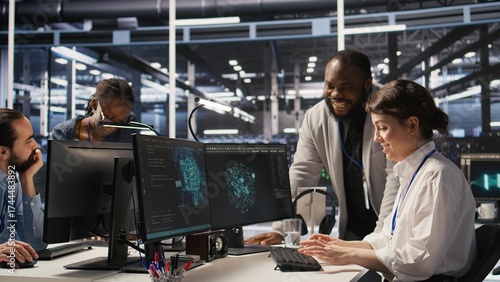 Fotografi Joyous data center team leader giving high five to worker after successful infrastructure upgrade