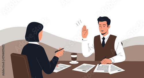 Business meeting between a man and a woman with the emphasis on agreement