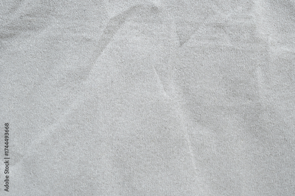 Obraz premium Light Gray Textured Fabric Background with Subtle Creases and Soft Natural Feel for Design and Textile Applications