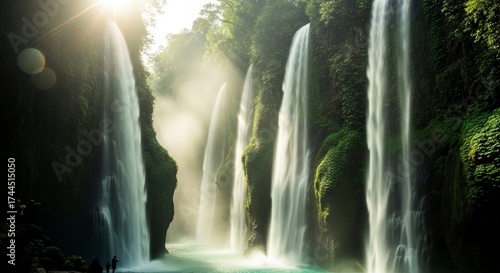 Cascading Waterfalls in a Lush Green Forest with Sunlight.