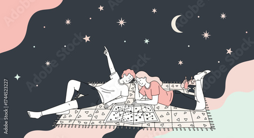 Couple lying on a blanket stargazing and pointing at the stars during the night