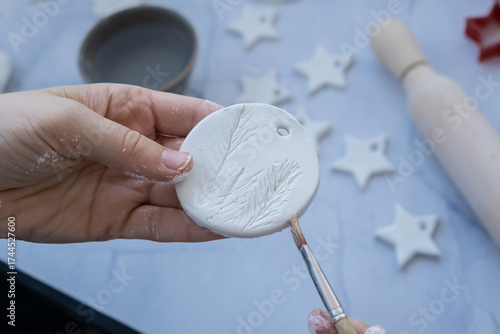 Master class of painting Unrecognizable artist do it yourself air dry clay crafts for Christmas tree decor holiday. Decoration gift idea Handmade children craft. Step by step instruction of painting